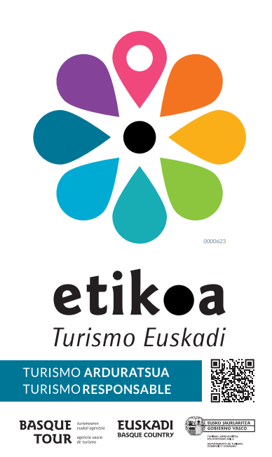Logo certificación Etikoa Turismo Euskadi, flor multicolor con marcador de ubicación, certificado de turismo responsable y sostenible del País Vasco